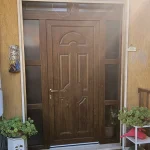 porta ingresso pvc effeto legno vetrata